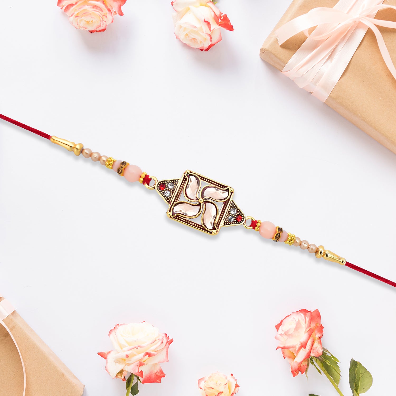 Designer Rakhi With Swastik-inspired Kundan Dial And Decorative Beads Designer Rakhi With Swastik-inspired Kundan Dial And Decorative Beads